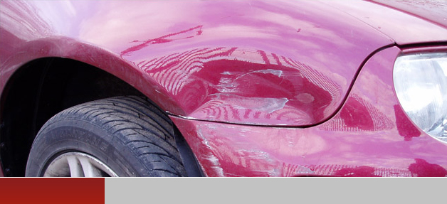 Dent in bumper of blue car