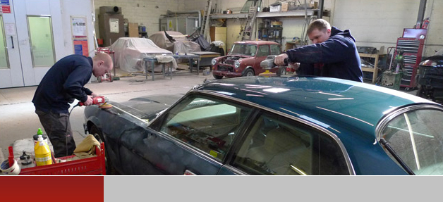 People working in the Autospray workshop